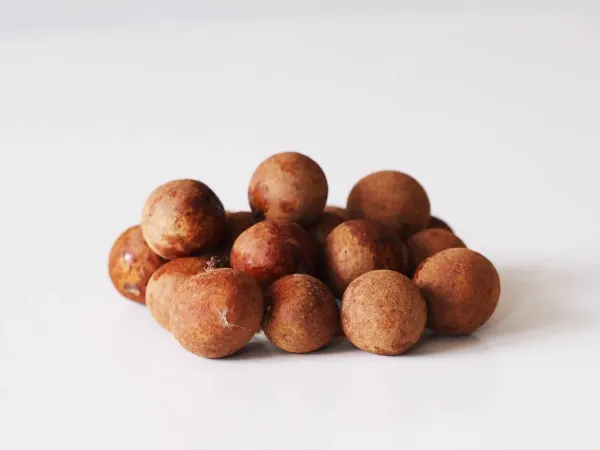 a small pile of whole fresh longan ready to be prepared for babies starting solids