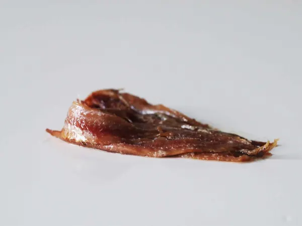 Anchovy filets on a table before being prepared for babies starting solids