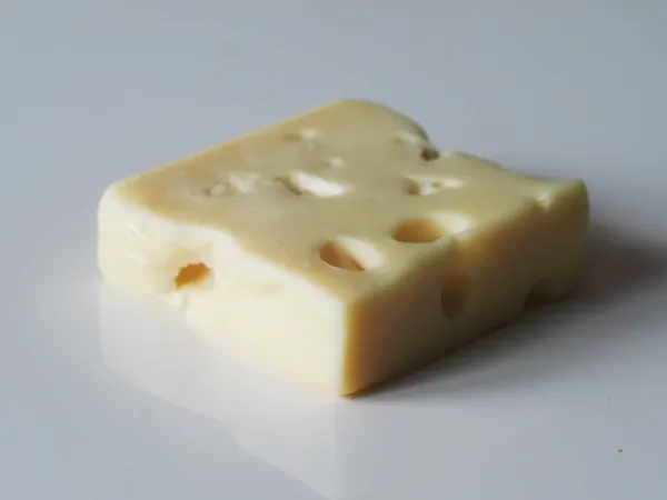 a block of Swiss cheese that will be cut for babies starting solids with baby-led weaning
