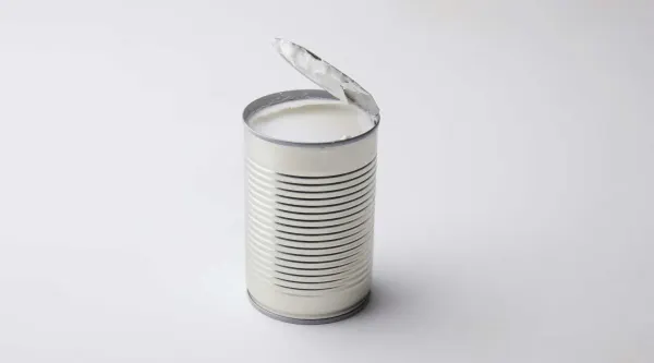 An opened can of coconut milk before being prepared for babies starting solids