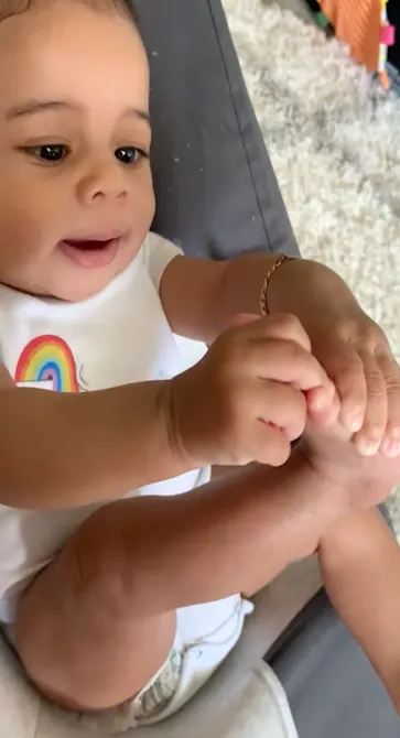 Kalani, 4mo reaches for her feet