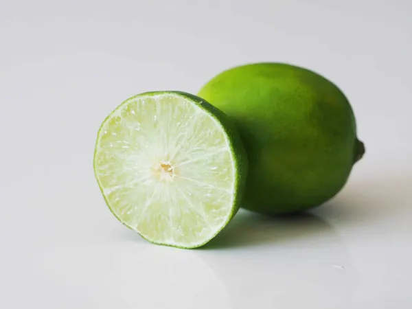 a lime cut in half on a table before being prepared for babies starting solid food