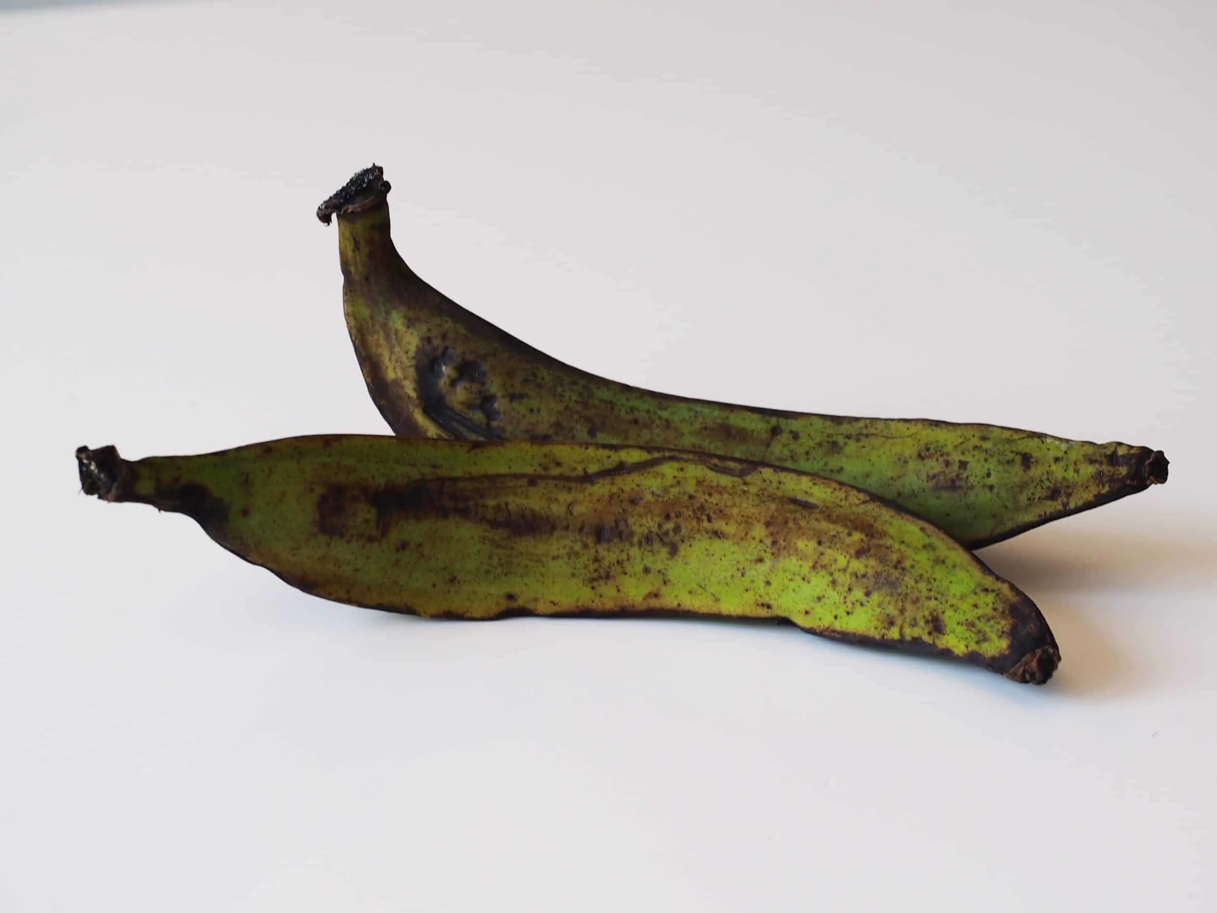 2 green plantains before being prepared for babies starting solid food