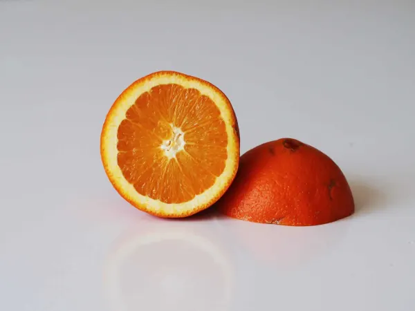 A naval orange cut in half before being prepared for babies starting solids