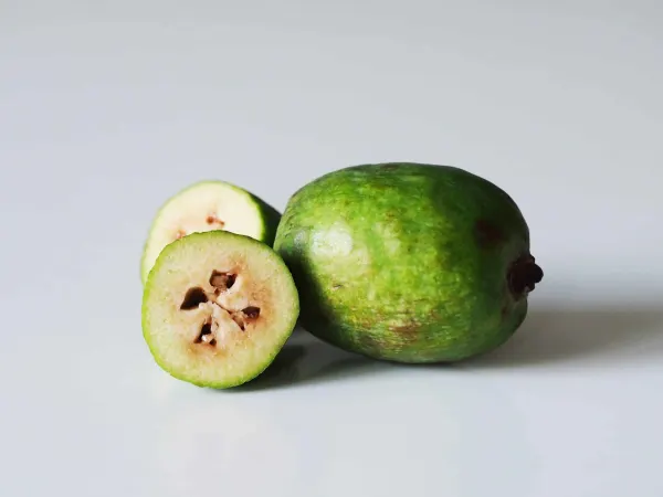 a fejoa fruit cut open on a table before being served to babies starting solids