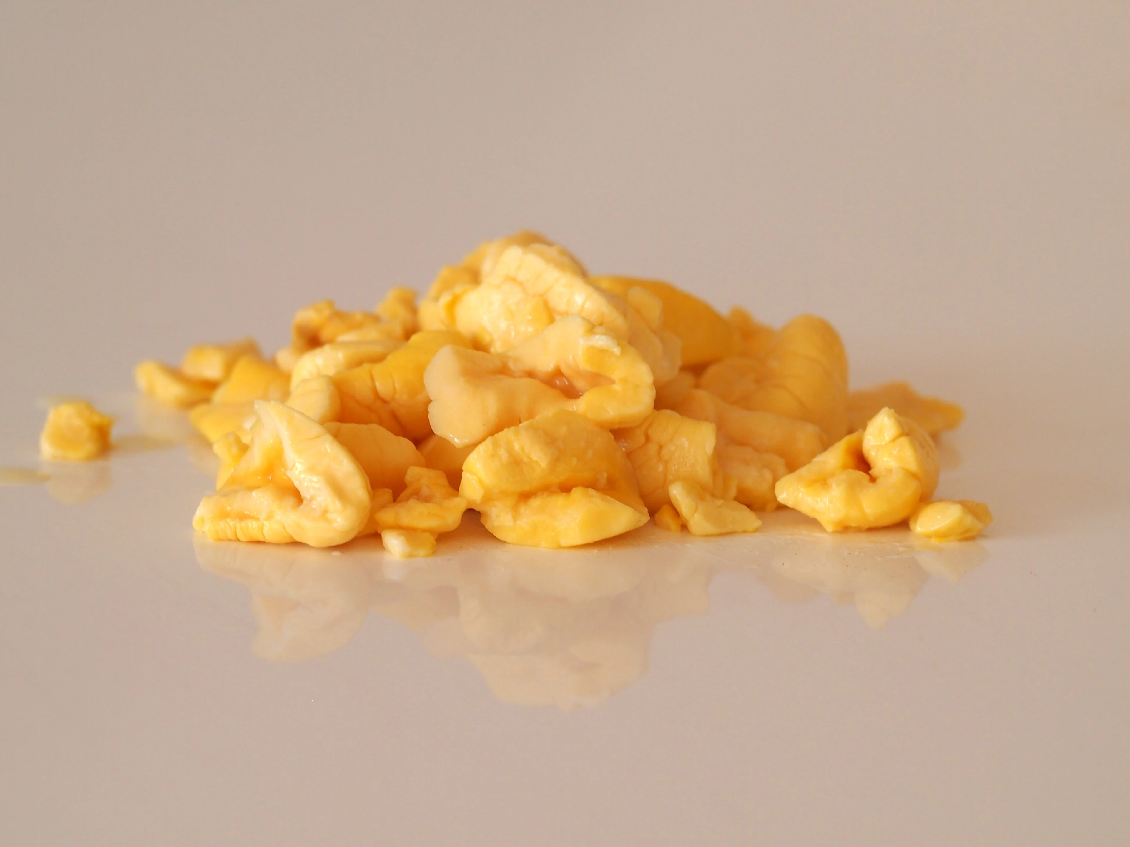 a photograph of a small pile of cooked ackee arils