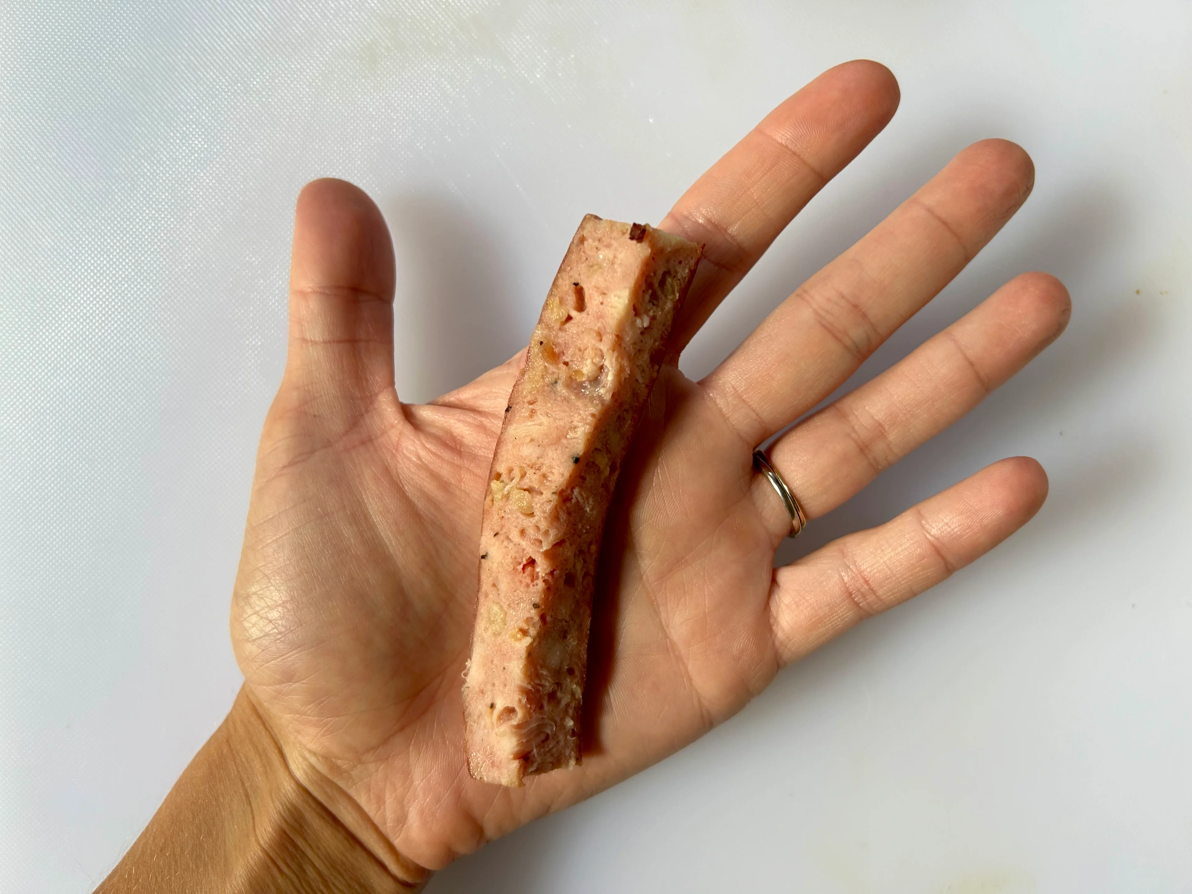 Sausage quartered sticks hand pic