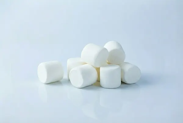When can kids have marshmallows a photograph of a small pile of large marshmallows on a white background