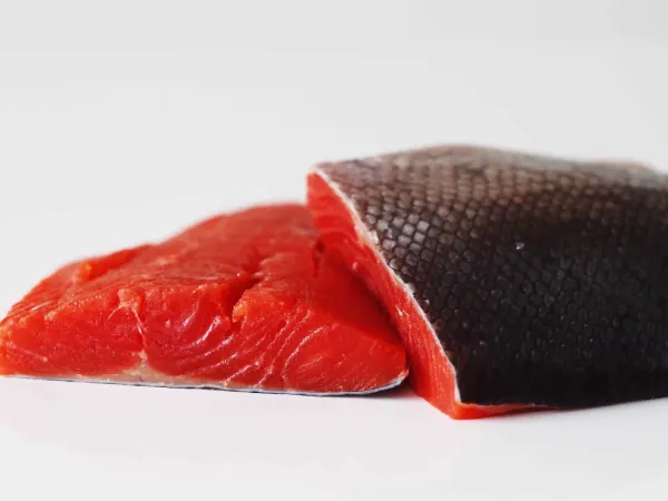 Fresh sockeye salmon on a table before being prepared for babies starting solids