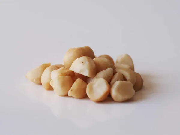 a pile of macadamia nuts before being prepared for a baby starting solid food