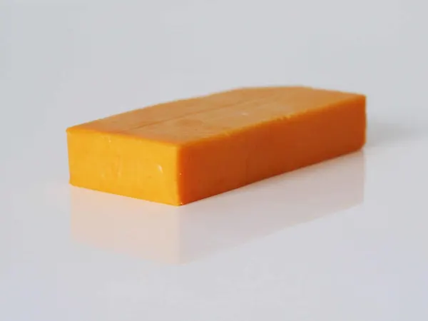 a block of Colby cheese ready to be prepared for babies