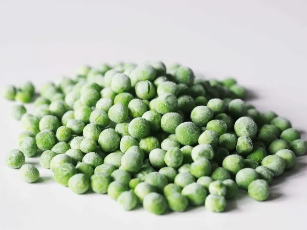 frozen peas on a table before being prepared for babies starting solid food