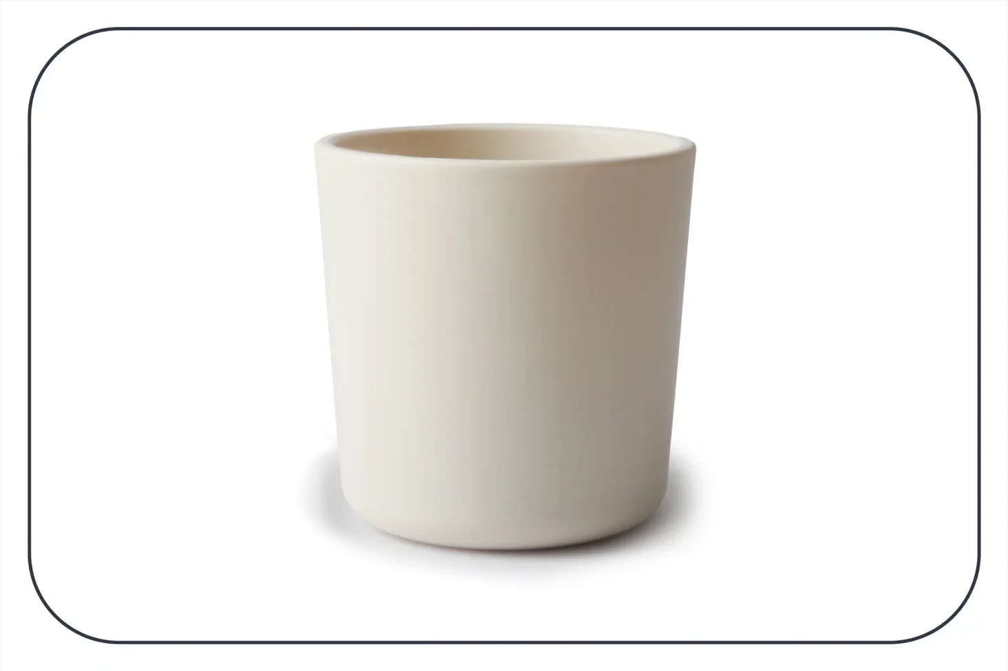 a photograph of a beige plastic open cup from Mushie