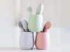 three cups and baby spoons on a counter for babies starting solids to promote a discount code for Solid Starts followers