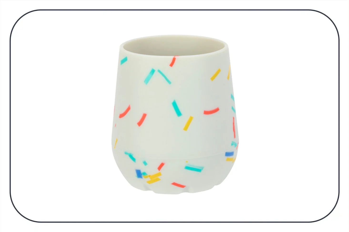 a photograph of a white silicone cup with pictures of rainbow sprinkles on it