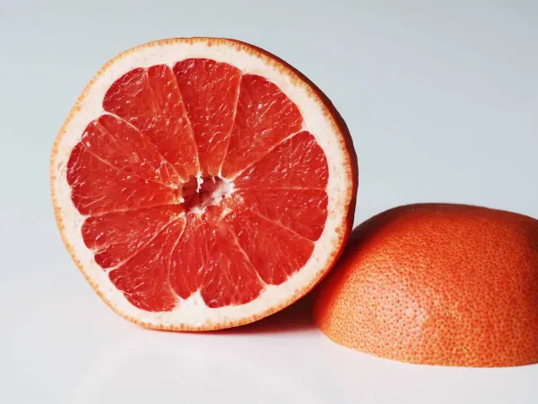 a grapefruit cut in half before being prepared for babies starting solid food