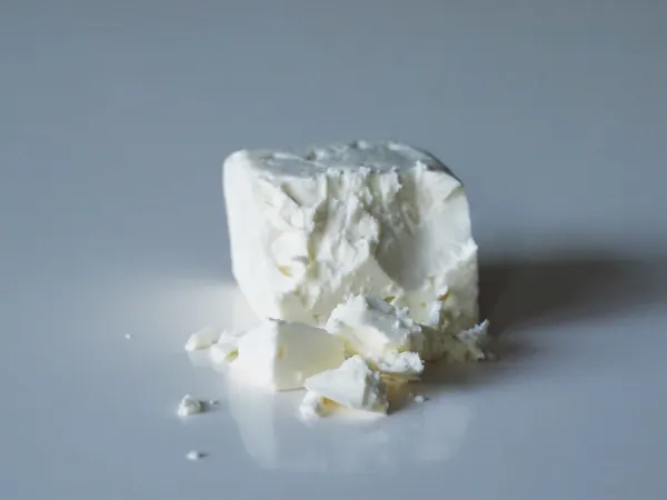 a block of feta cheese before being prepared for babies starting solid food