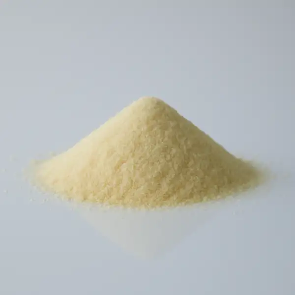 When can babies have semolina a photograph of a small pile of uncooked semolina on a white reflective surface