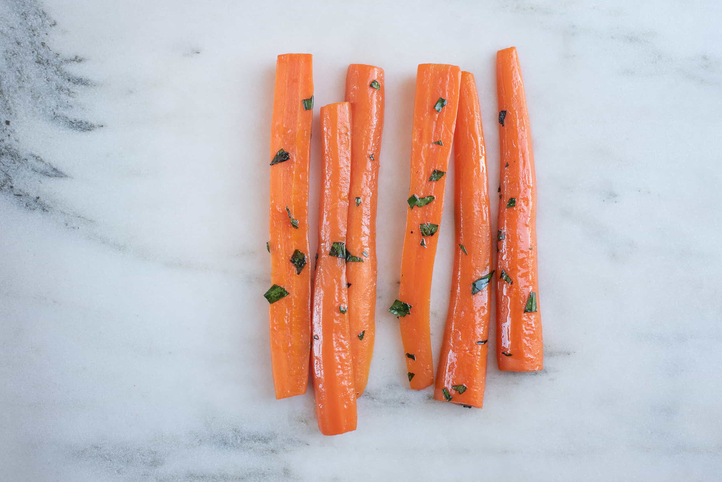 steamed carrots sliced lengthwise in a tarragon butter sauce
