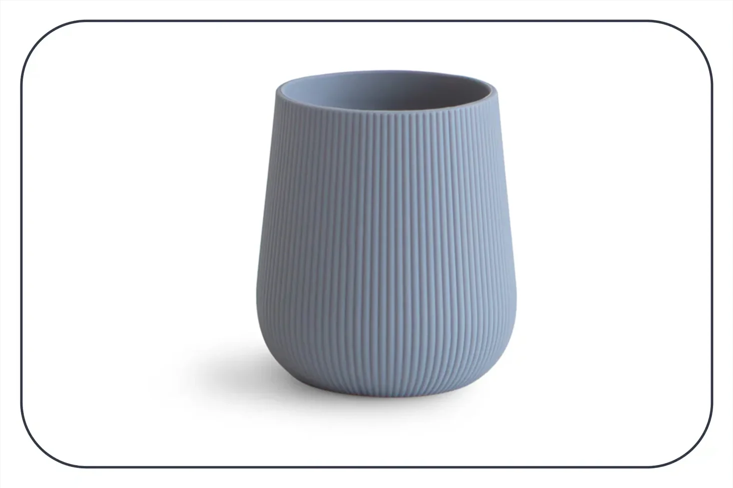 a photograph of a ridged pale blue silicon open cup from Mushie