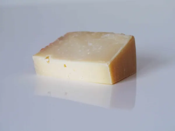 a block of asiago cheese ready to be prepared for toddlers