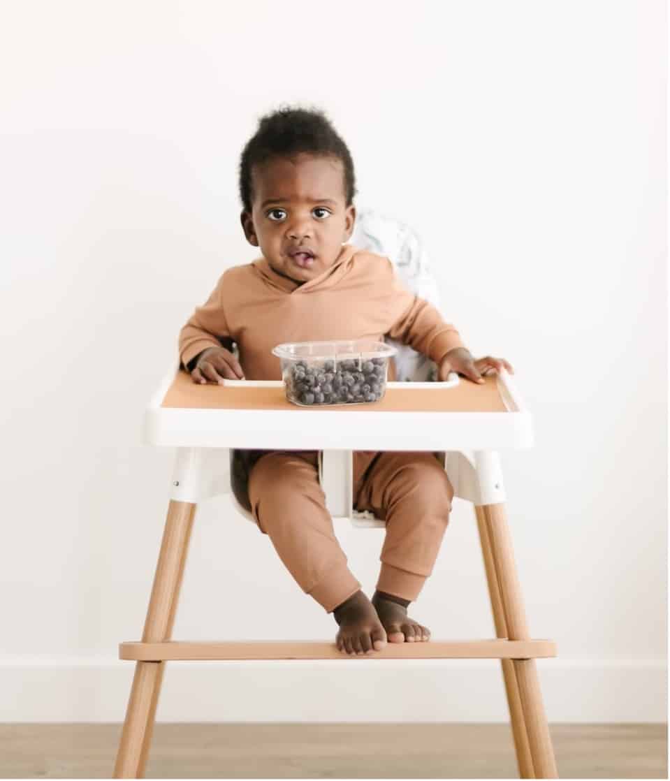 sitting in high chair