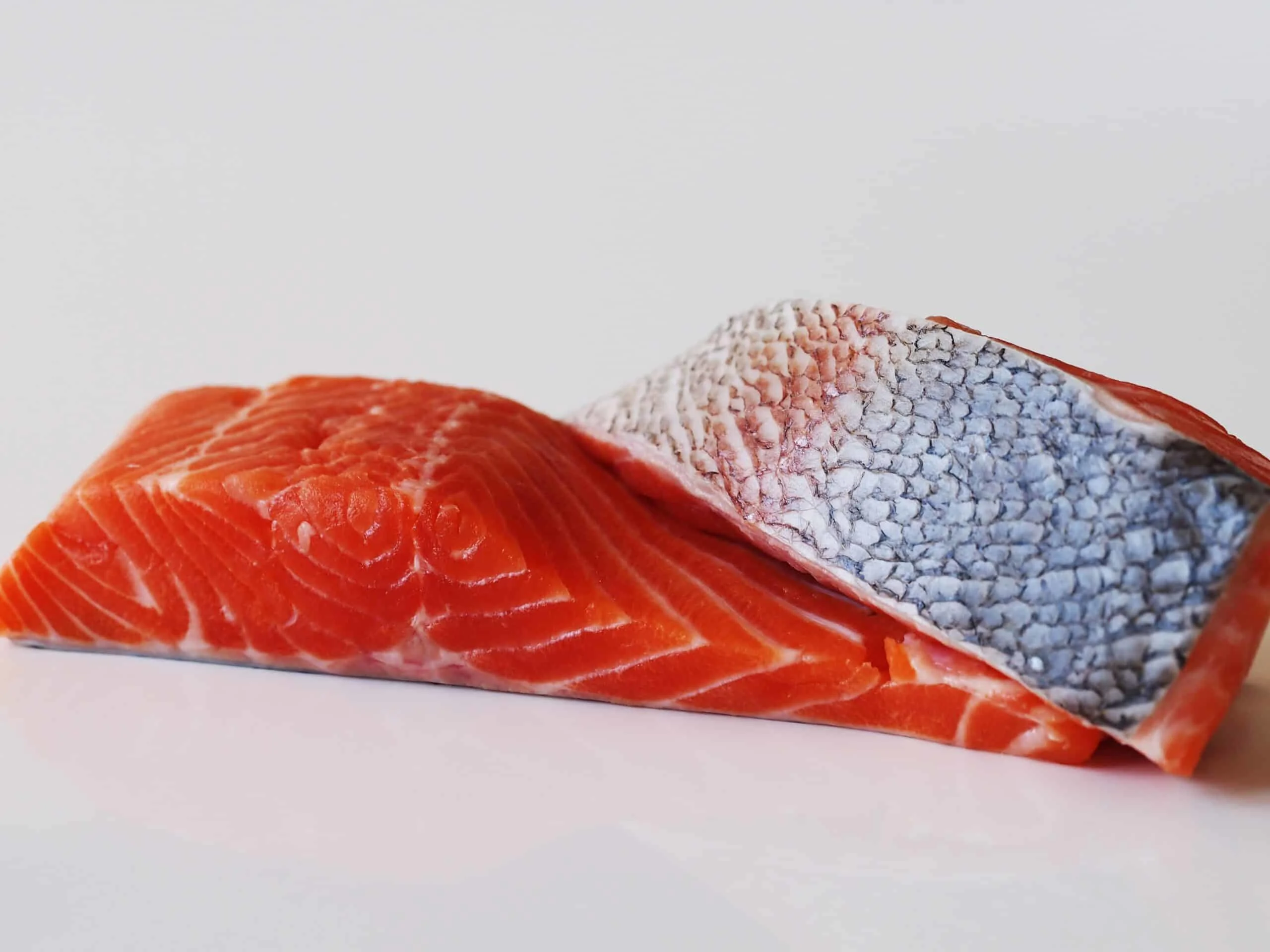 two fillets of red-fleshed trout ready to be prepared for babies starting solids