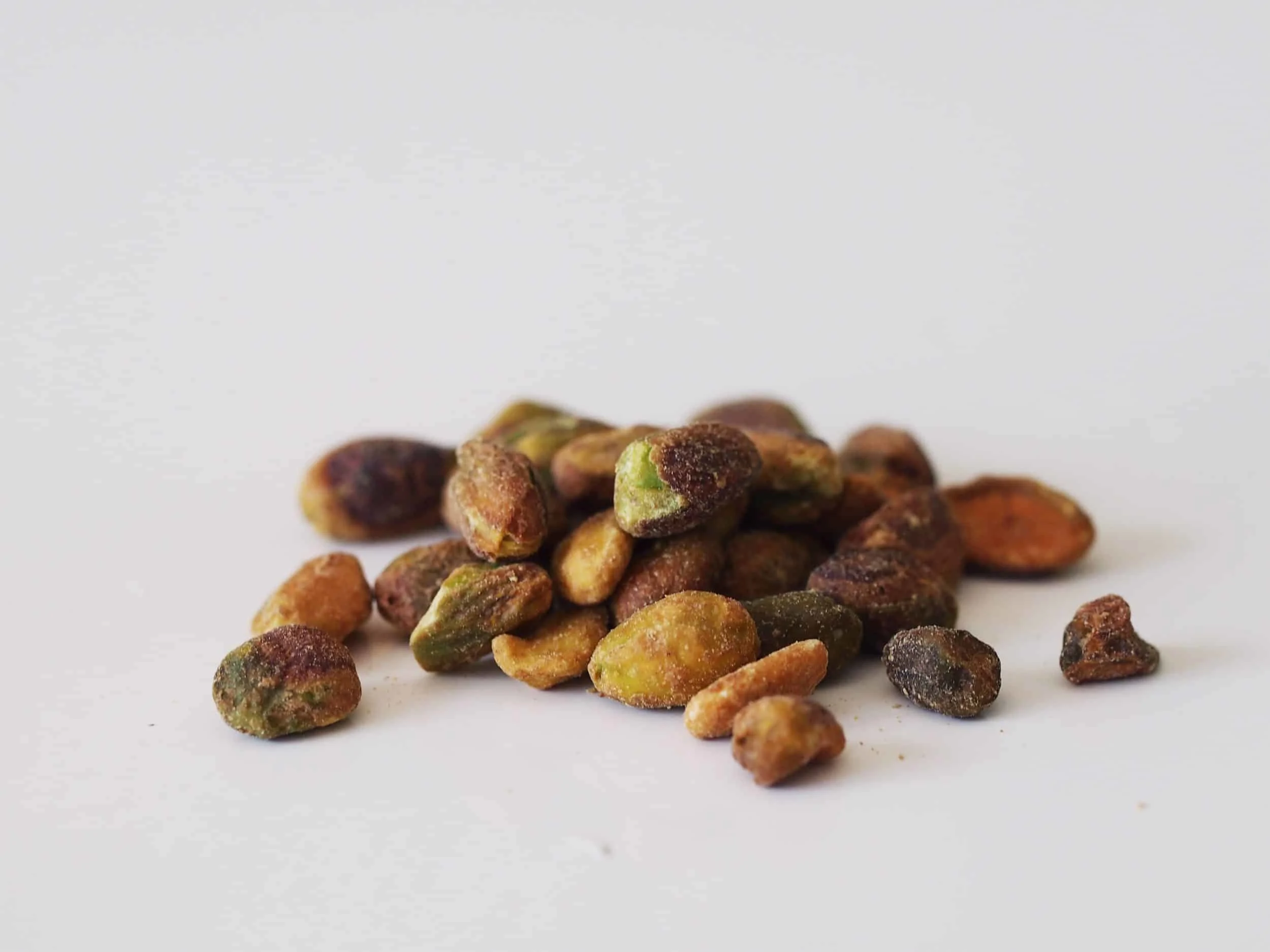 A pile of pistachio nuts before they have been prepared for a baby starting solid foods