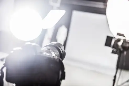Photograpy studio with lighting equipment and a camera