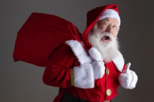 What does Santa use to help himself walk? image