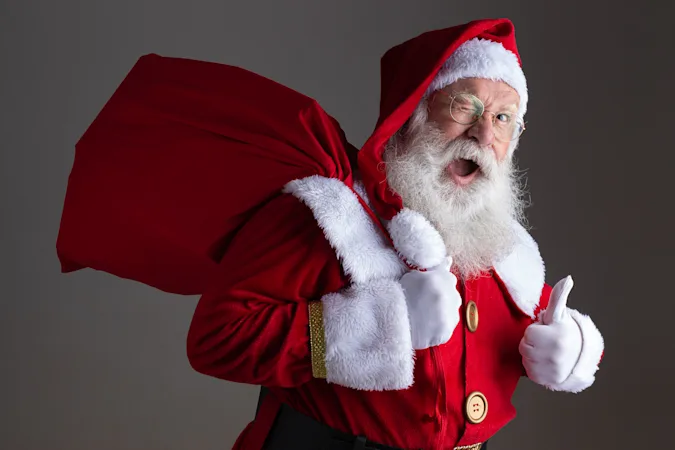 What does Santa use to help himself walk? image