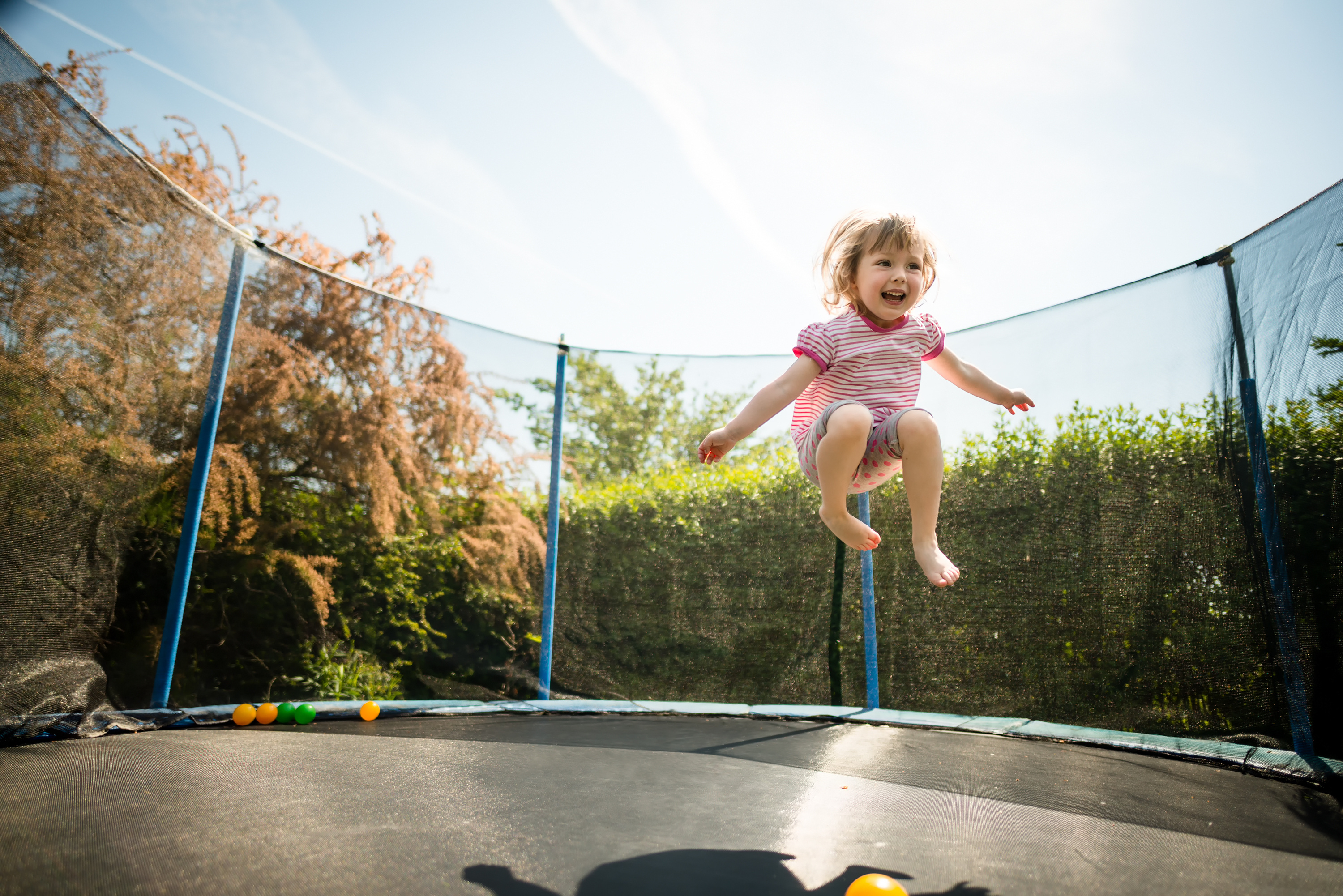 What season is it when you are on a trampoline? image