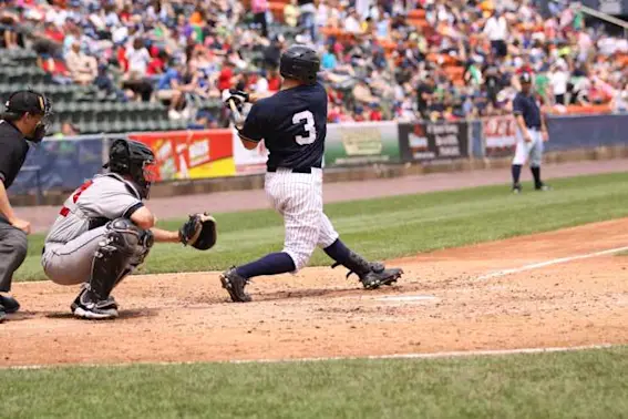 What runs around a baseball field but stays still at the same time image