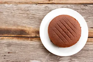 What type of cake never comes with frosting? image
