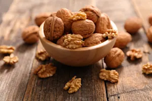 How do you make a walnut laugh? image