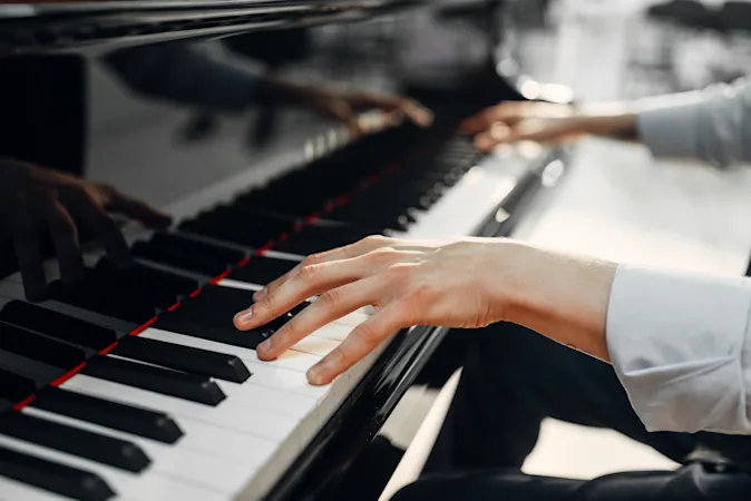 Where does a pianist go on vacation? image