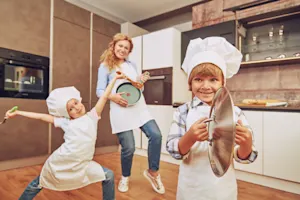 What do families sing when it strikes midnight on Thanksgiving? image
