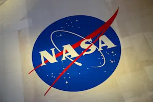 What grade did the NASA employee get on her exam? image