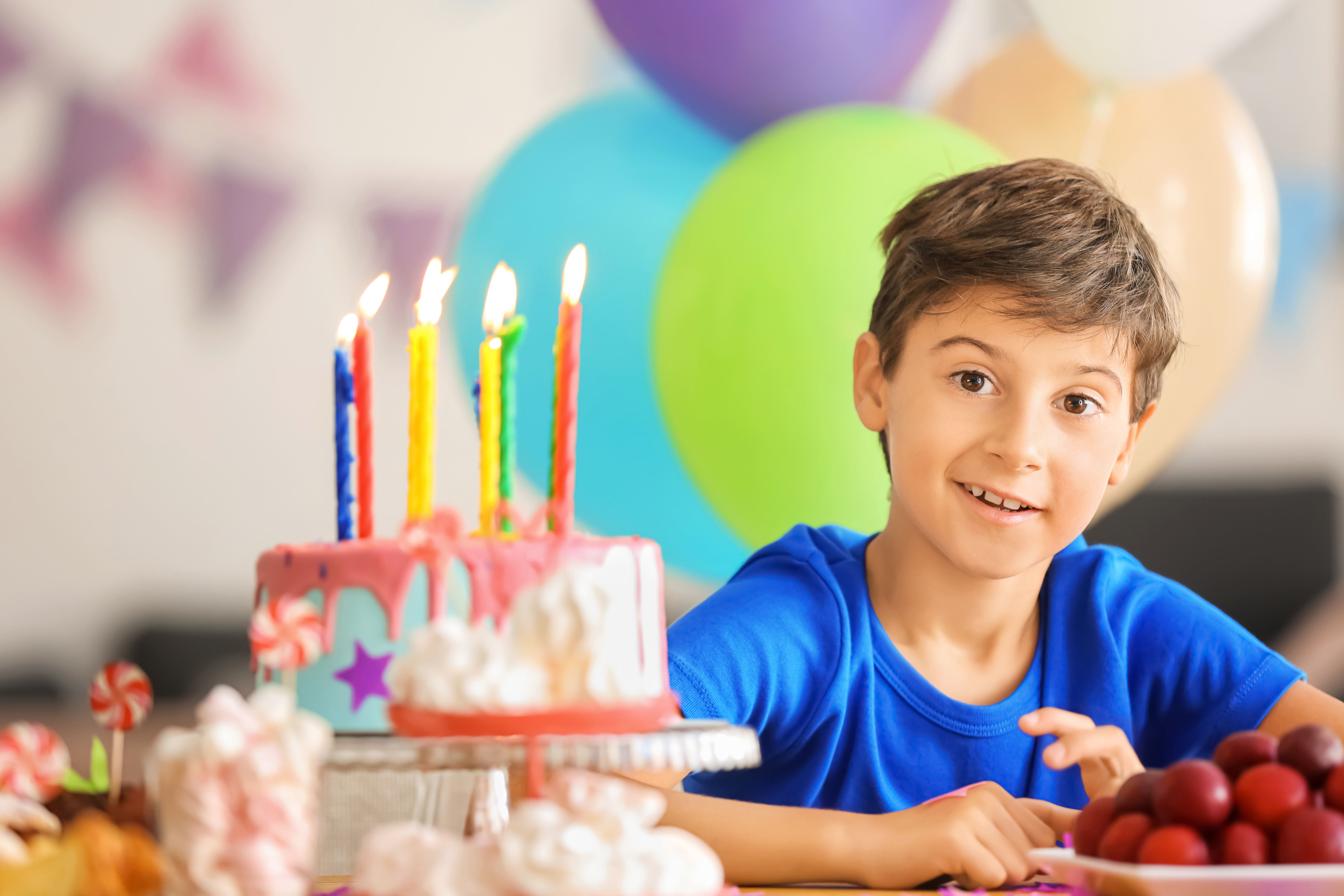 Why did the boy spit out his birthday dessert? Image