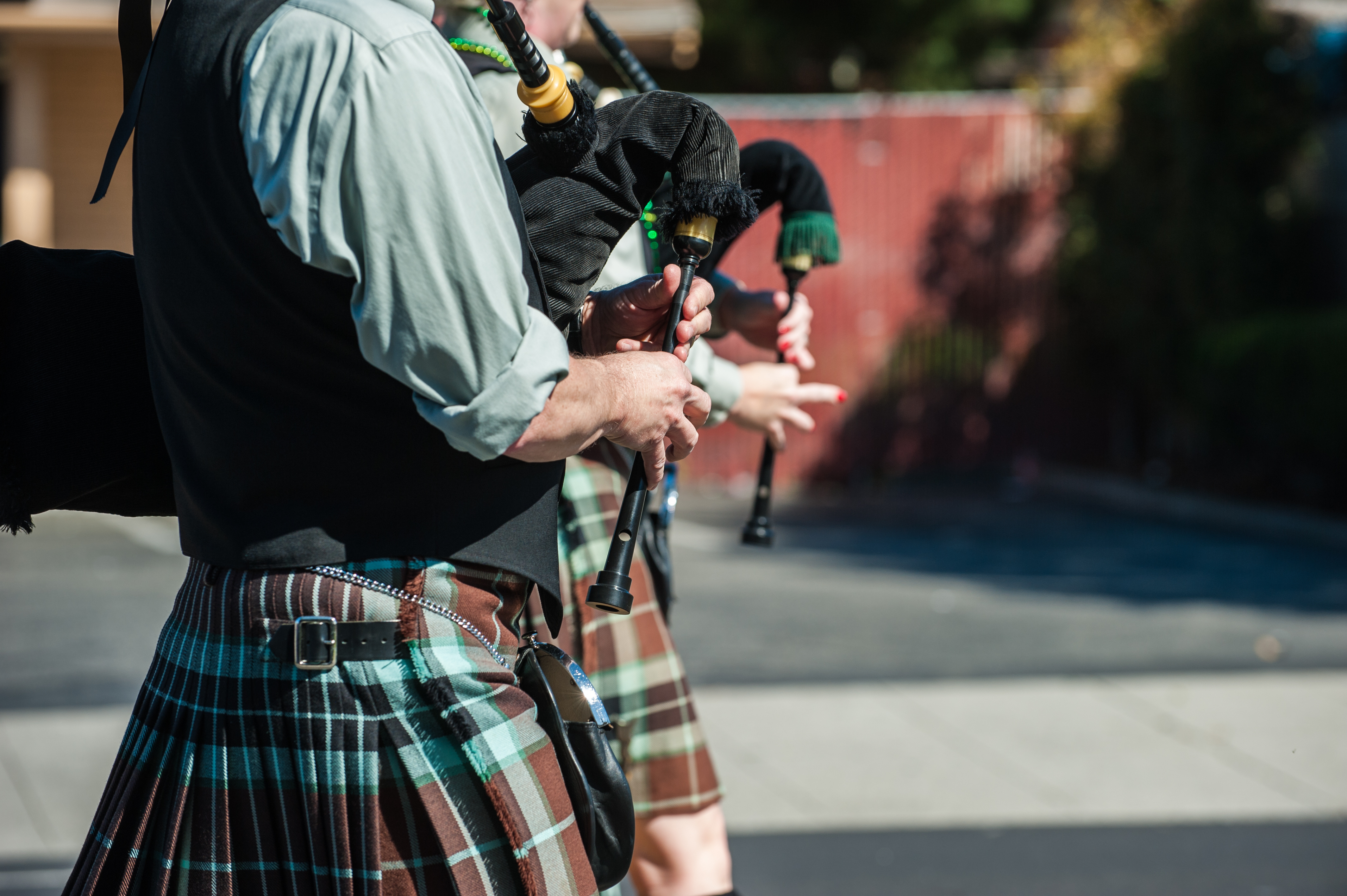 Why do bagpipe players walk when they play? image