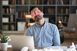 What do you call a businessmen asleep in a meeting? image