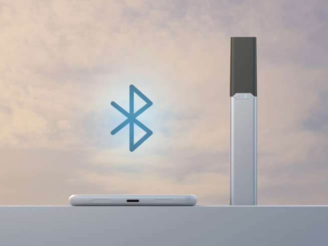 JUUL2 Device shown with Bluetooth logo against cloudy sky background