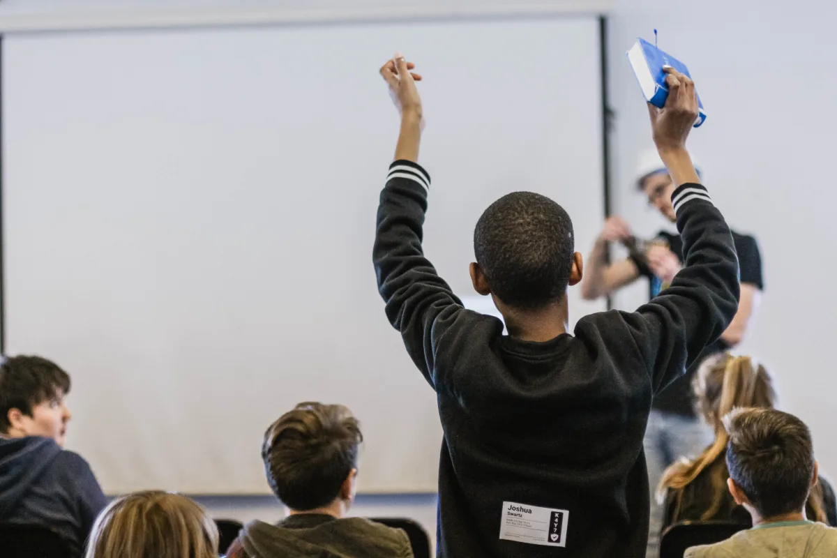 Student standing in classroom