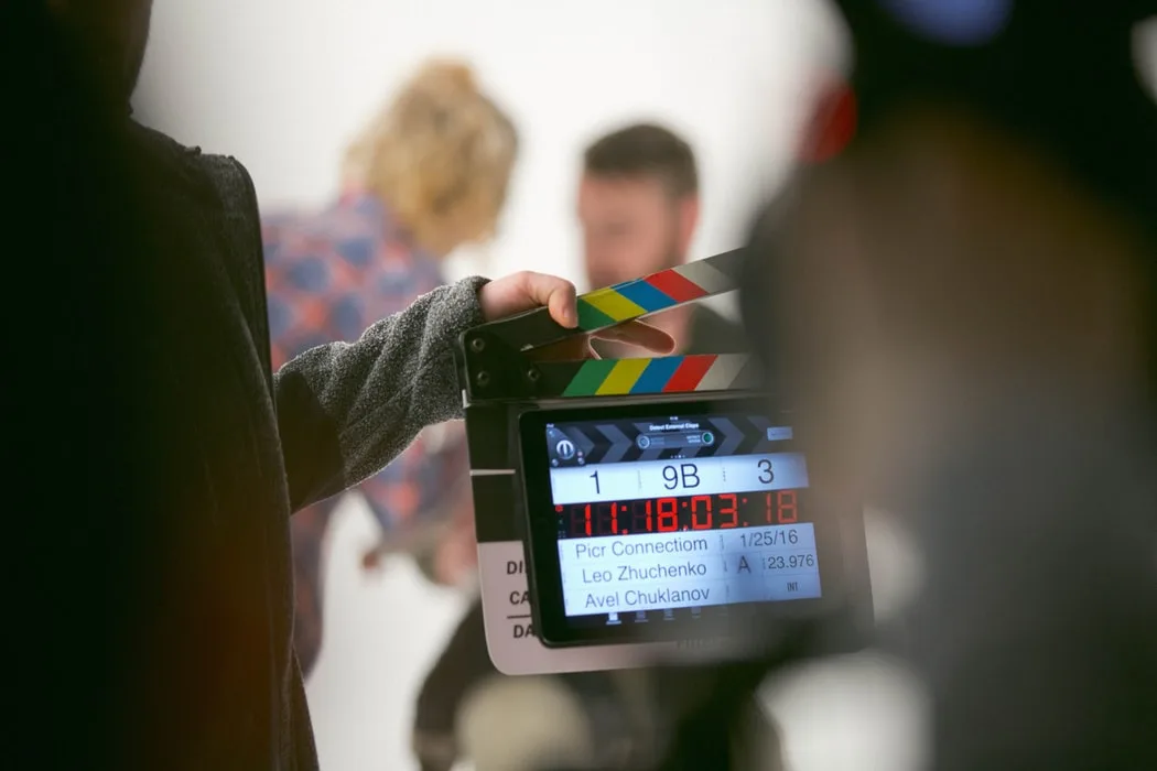 a group of people on set about to start filming