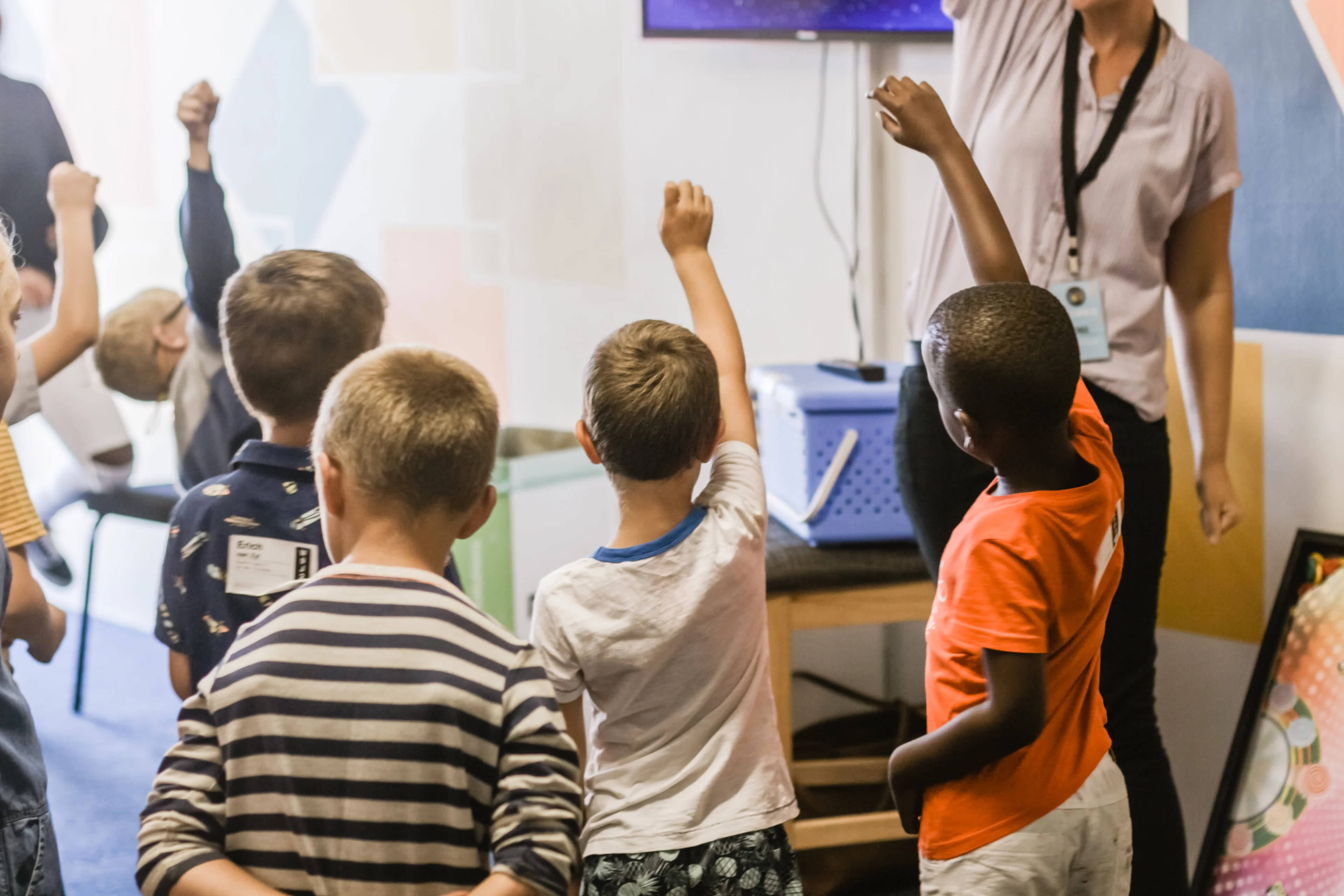 Children raising their hands