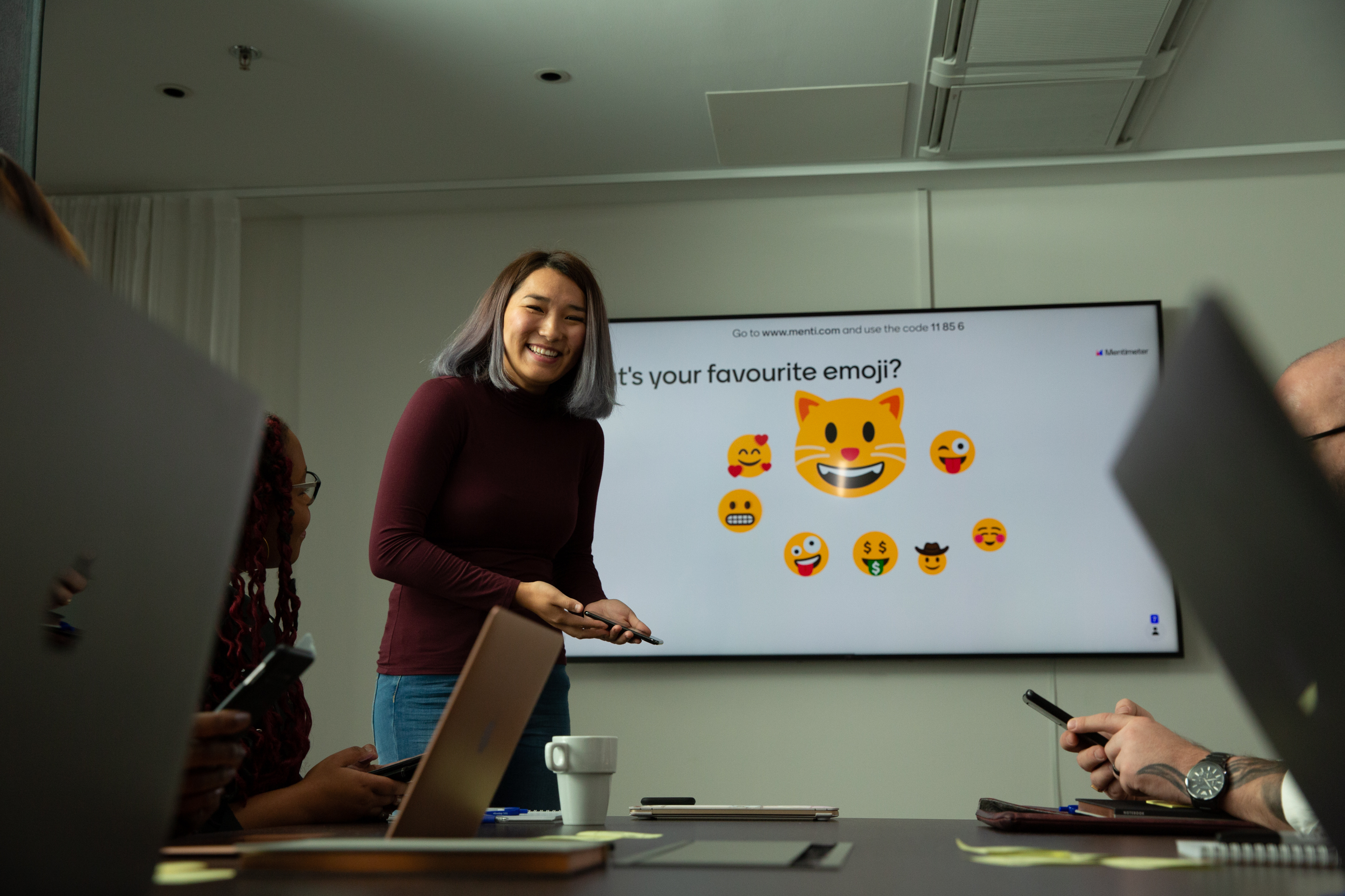 A meeting check-in voting for favorite emojis