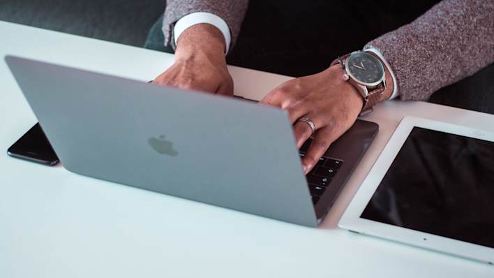 Person working on a laptop. Unsplash image.