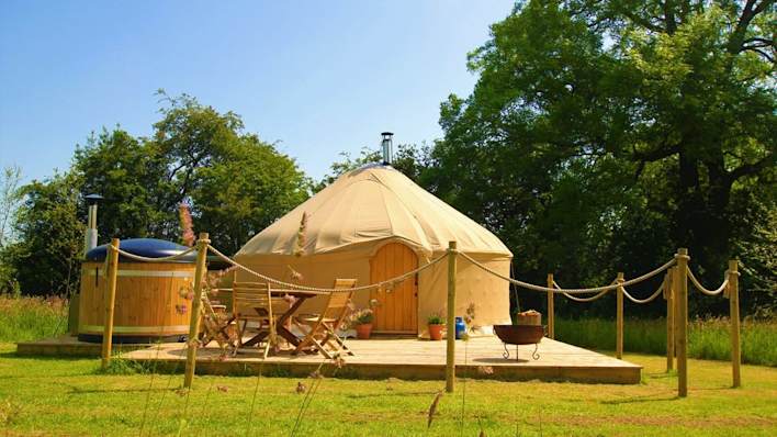 Collection of high-end yurts with, private outside hot tubs, set within the beautiful Yorkshire Dales. Image owned by https://yurtshire.co.uk/.