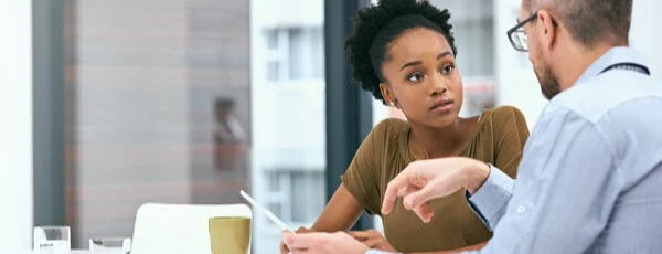 Person paying off credit card debt with a financial plan