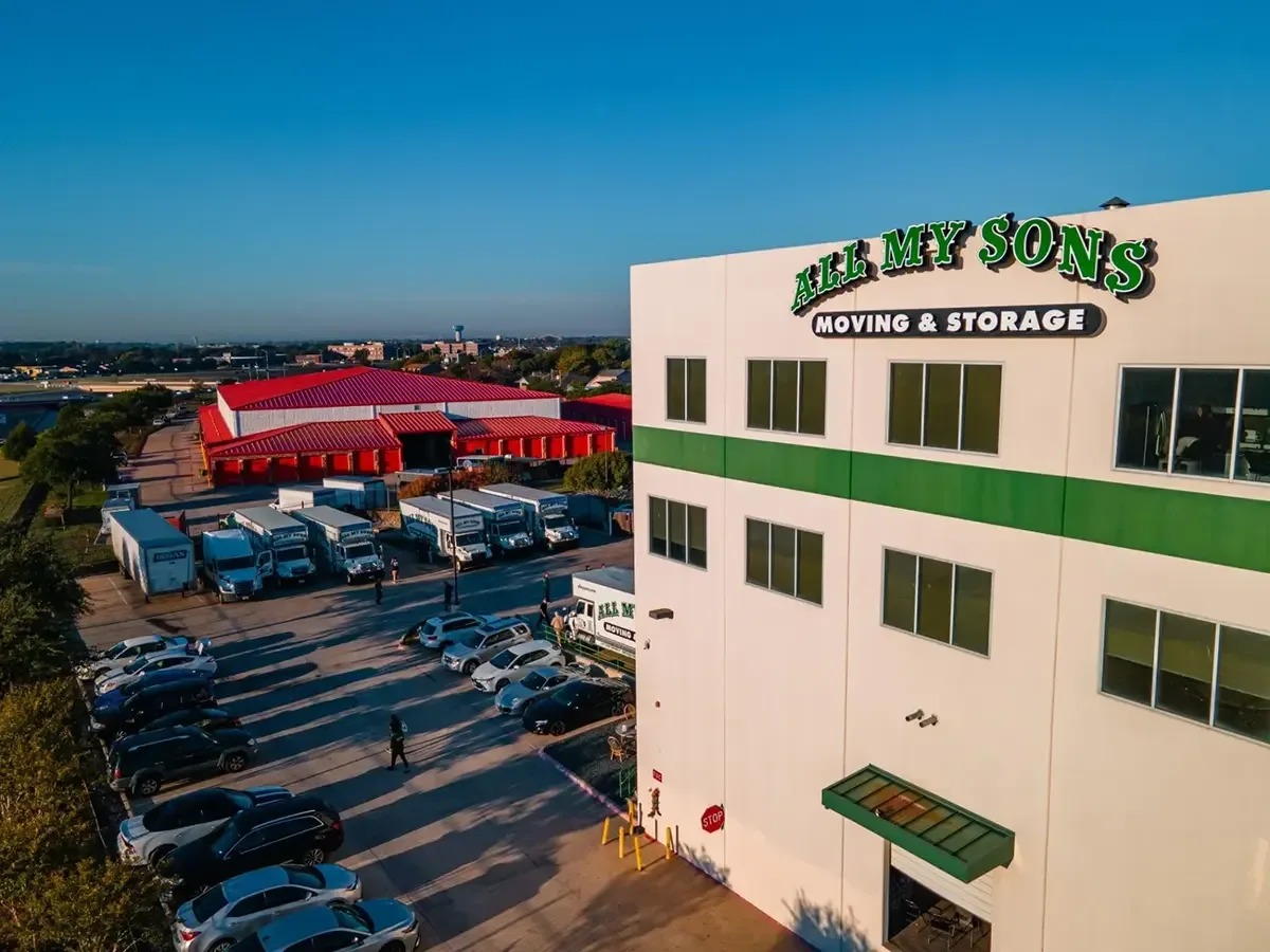 All My Sons Moving and Storage building with moving trucks parked behind it.